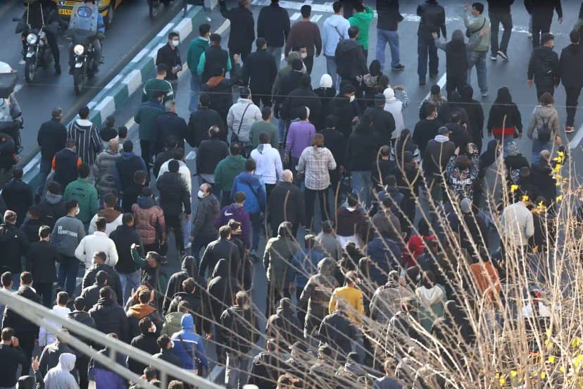 Crowds march through an Iranian city during nationwide economic protests
